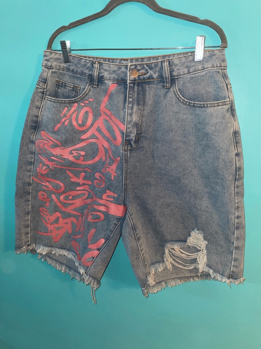 Distressed Denim             Women’s Shorts with Pink Graffiti Detail